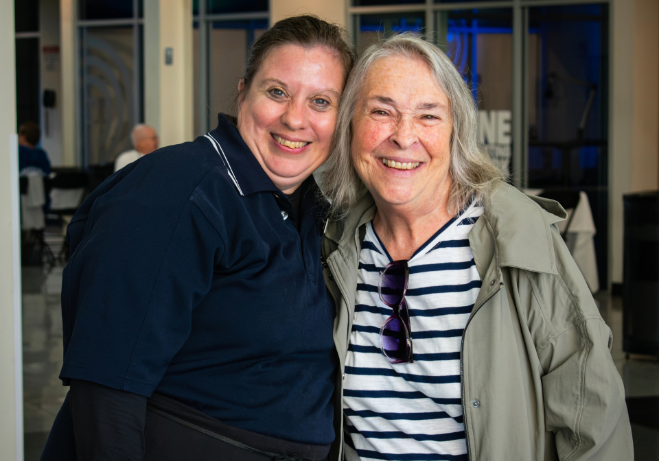two women smiling during their reconnection