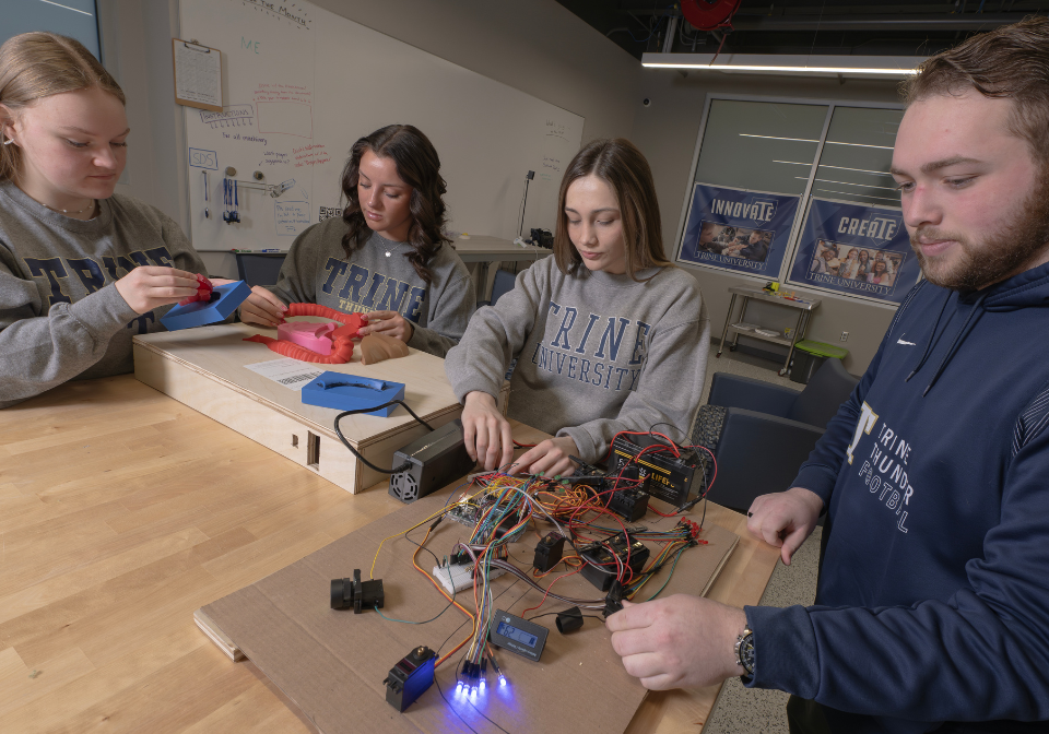 students work on the digestive track trainer senior design project