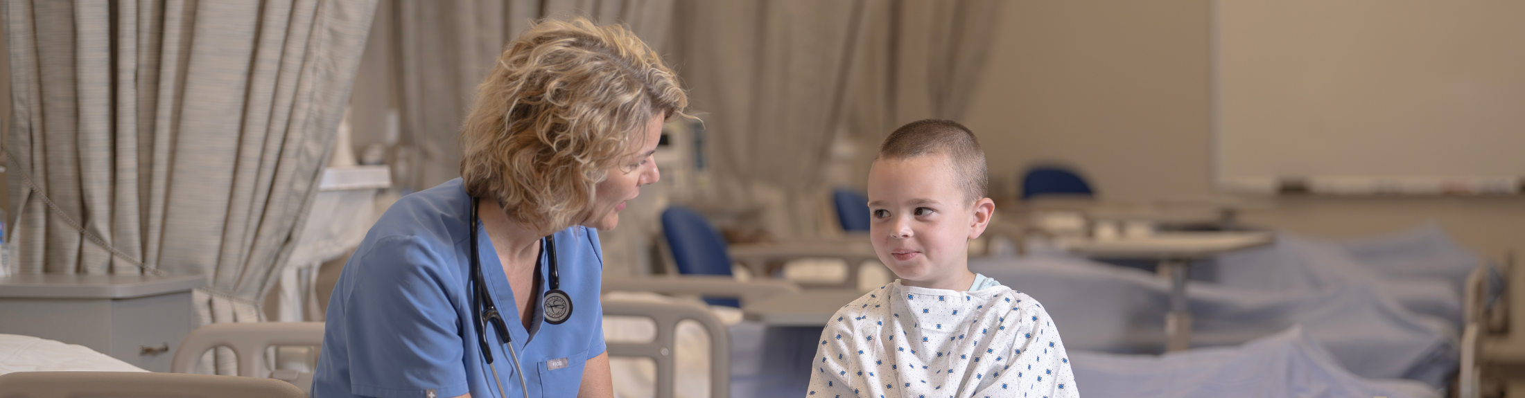 nurse checks on child patient