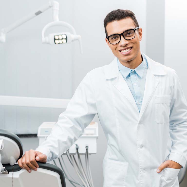 Dentist standing near chair