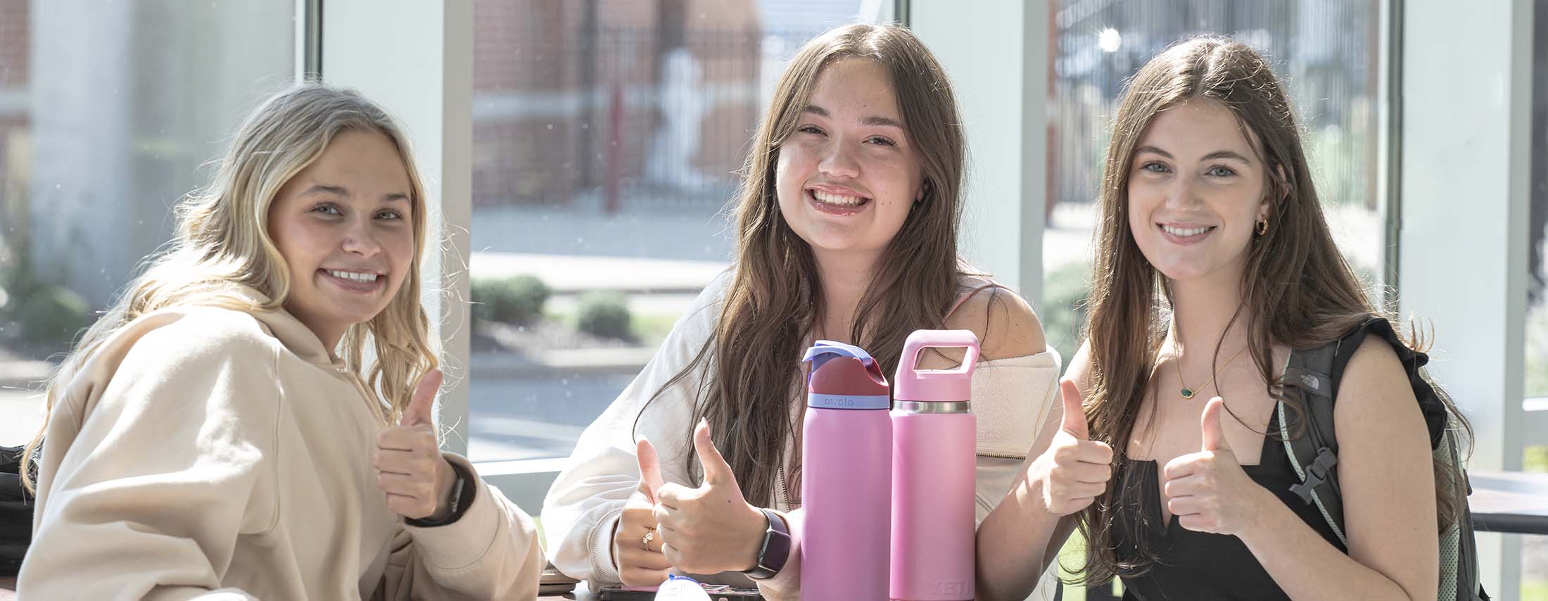 Smiling girls at table