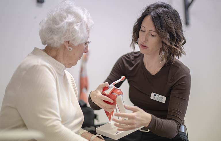 Occupation therapist and patient