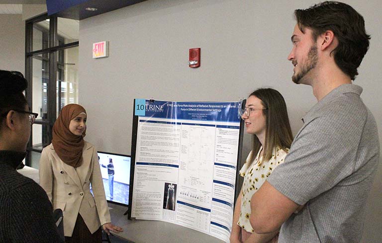 Students with STEM Symposium presentation