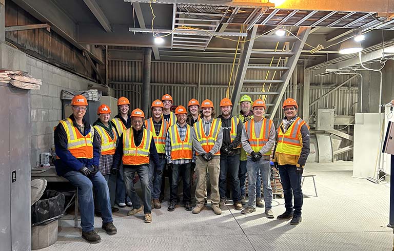 Civil engineering faculty and students in hard hats