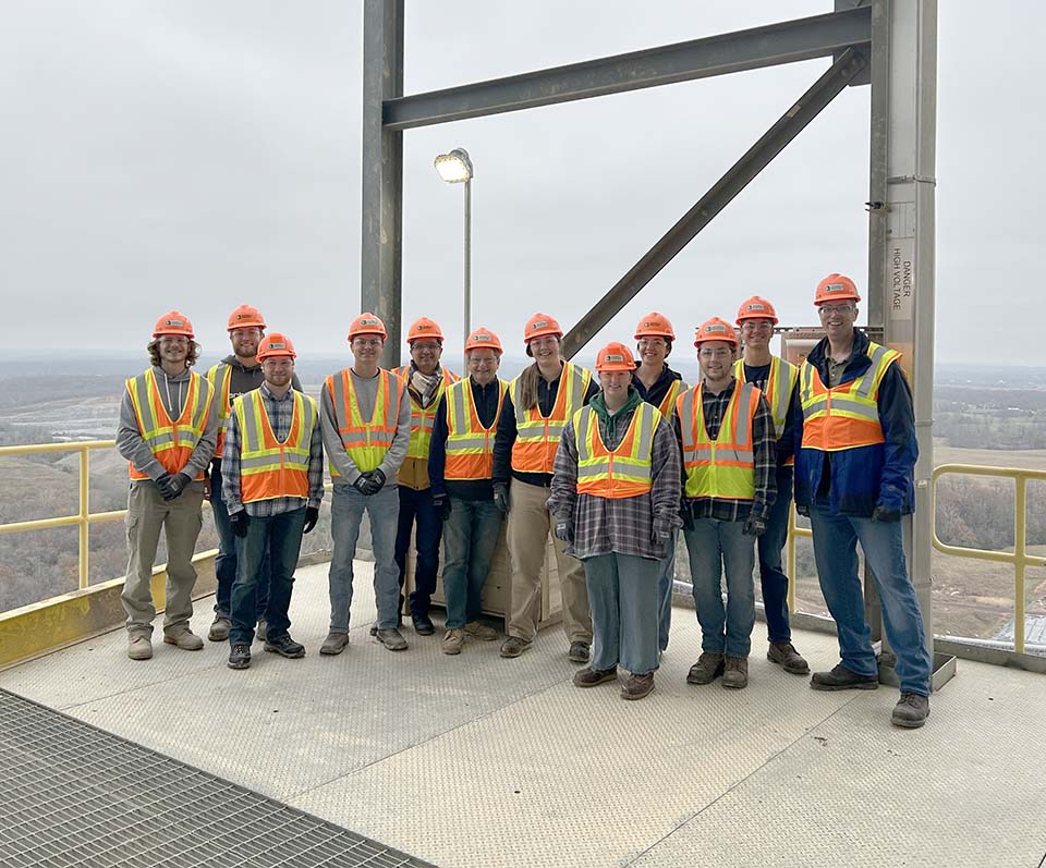 Civil engineering students and faculty on tower