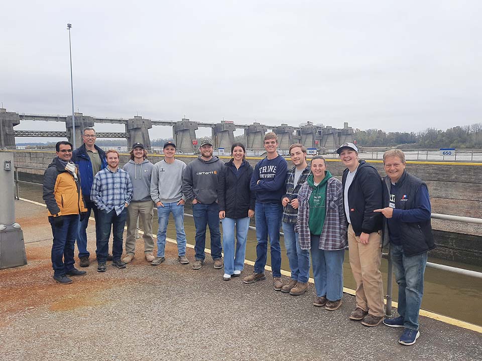 Civil engineering students and faculty at dam