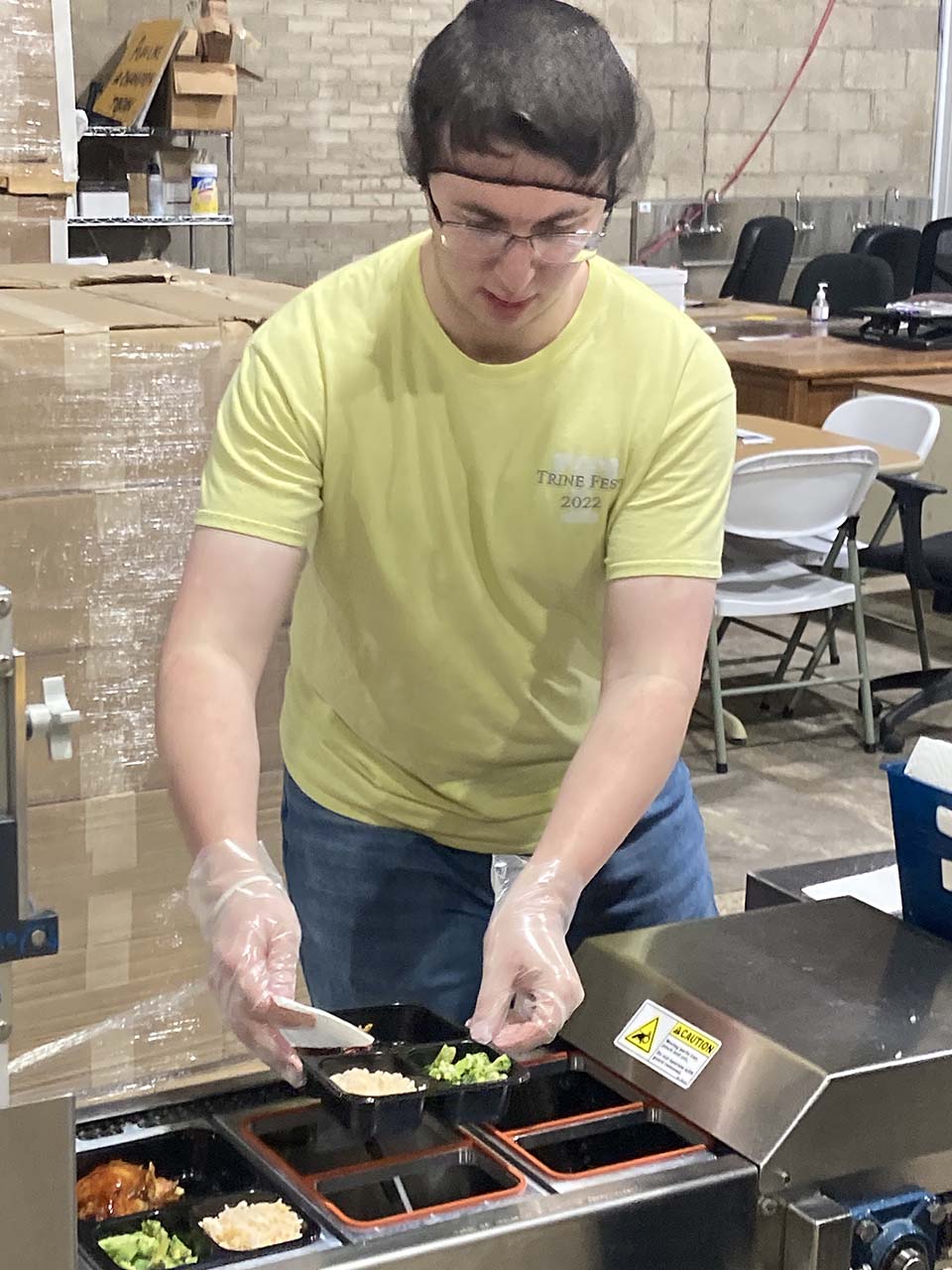 Male student packing a meal