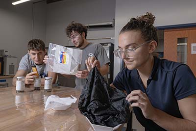 Senior design team that developed a more efficient soot recovery system