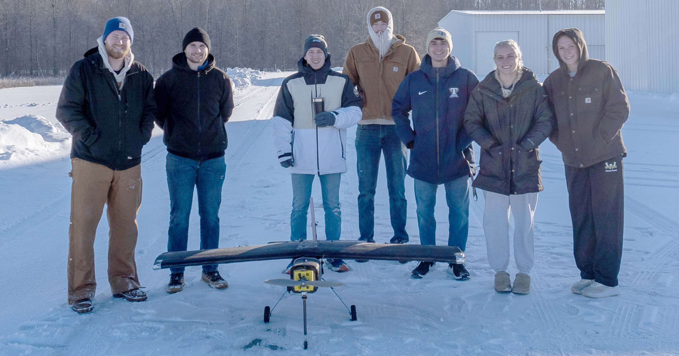 Design Build Fly team with aircraft