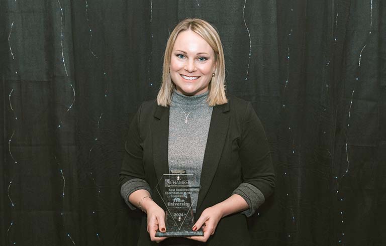 Rachel Troutman with Trine University Ebbie award