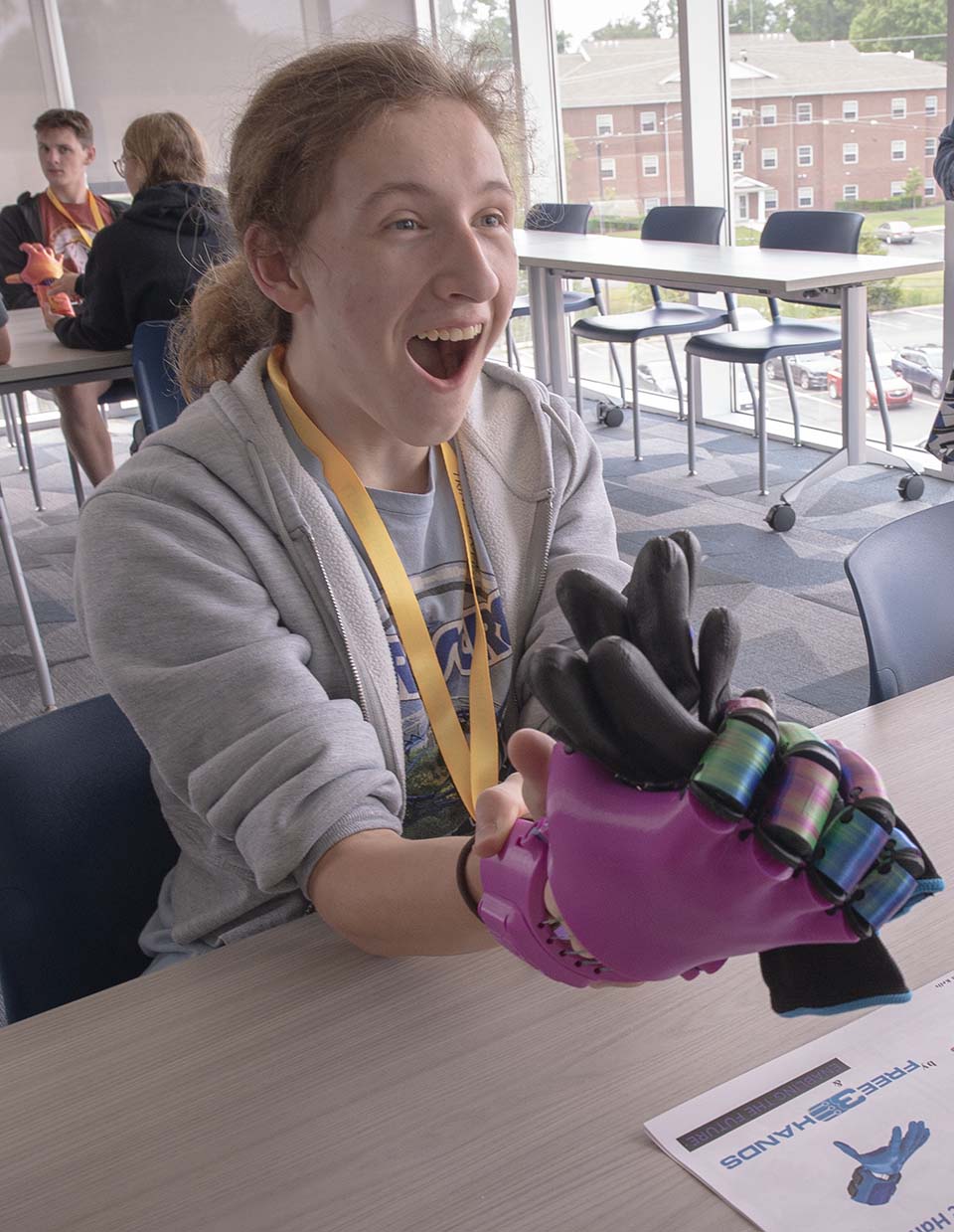 Students working with 3D-printed hand