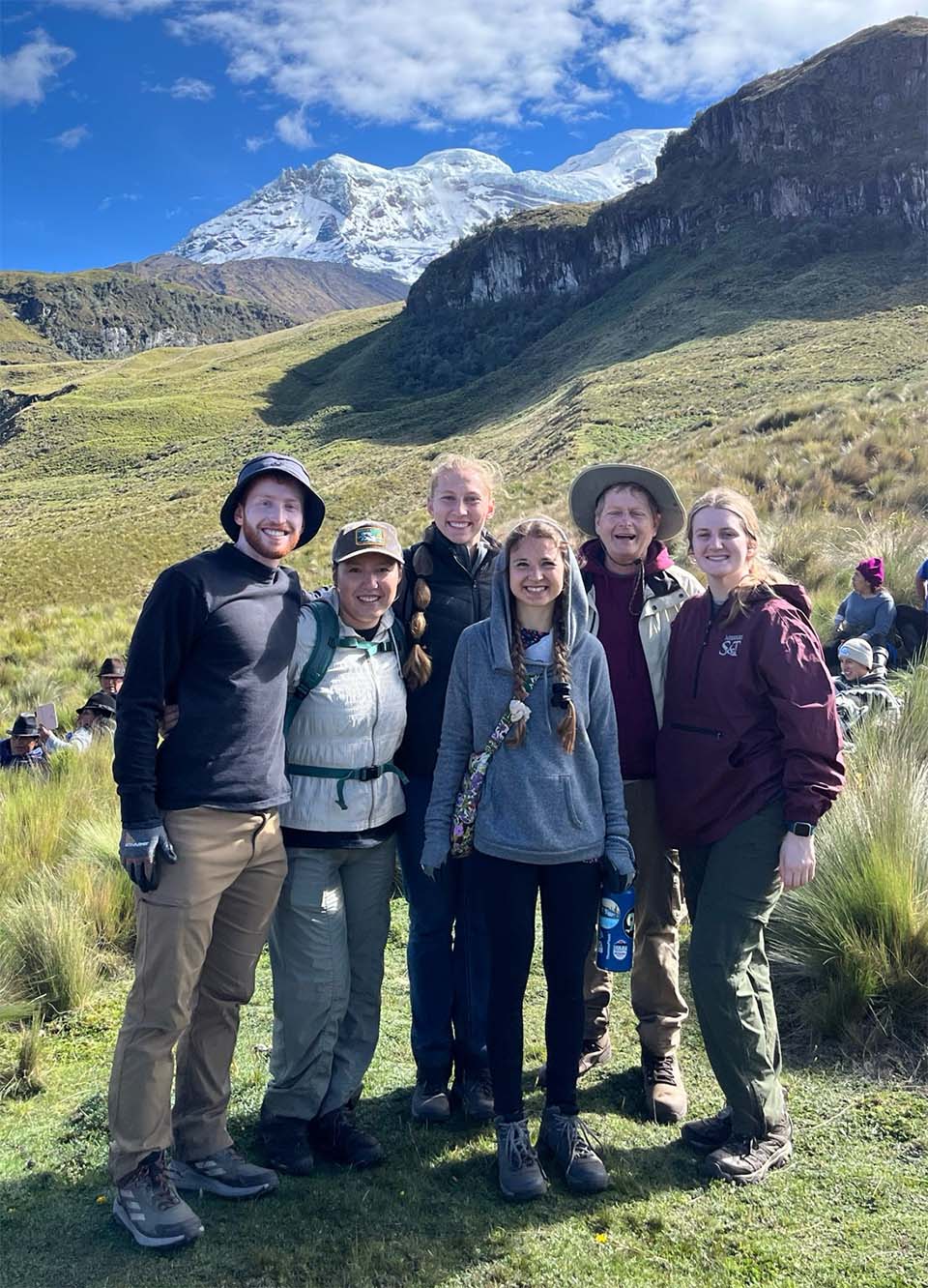 Engineers Without Borders team in Ecuador with inactive volcano in background
