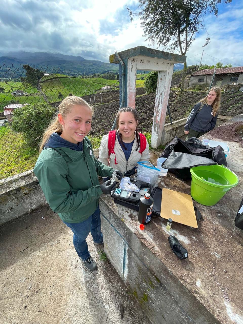 Team members testing water