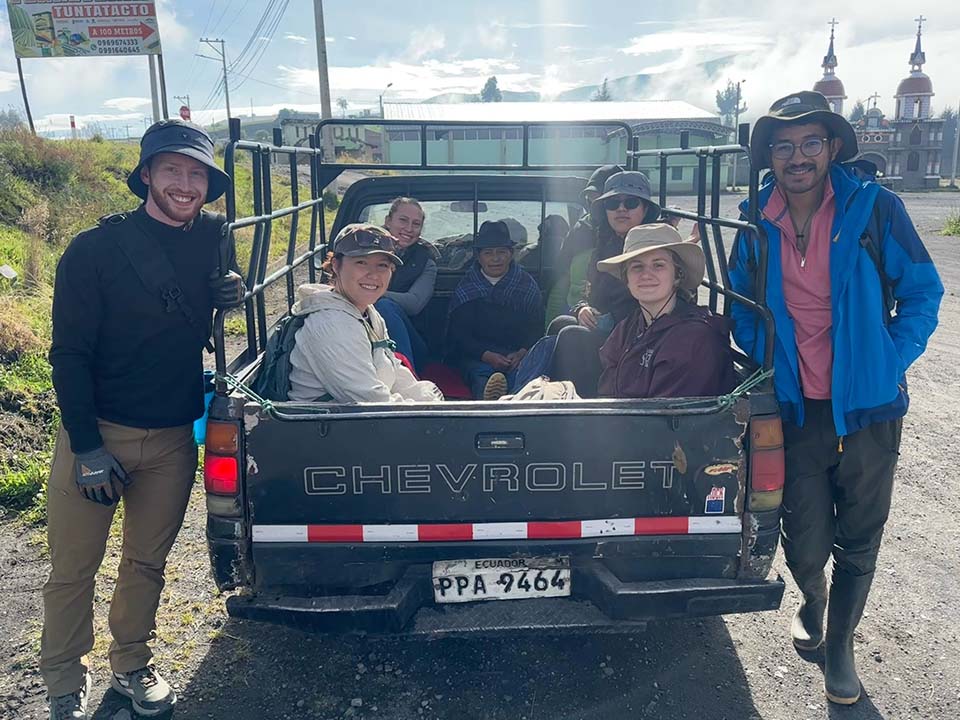 Engineers Without Borders team getting ready to ride in pickup trucks