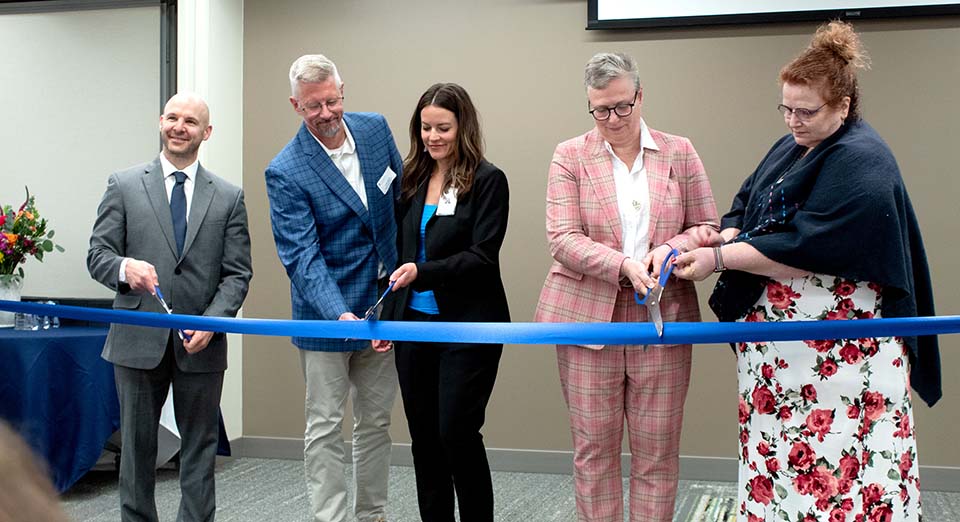 Trine and Cameron officials and Gutstein family cutting ribbon