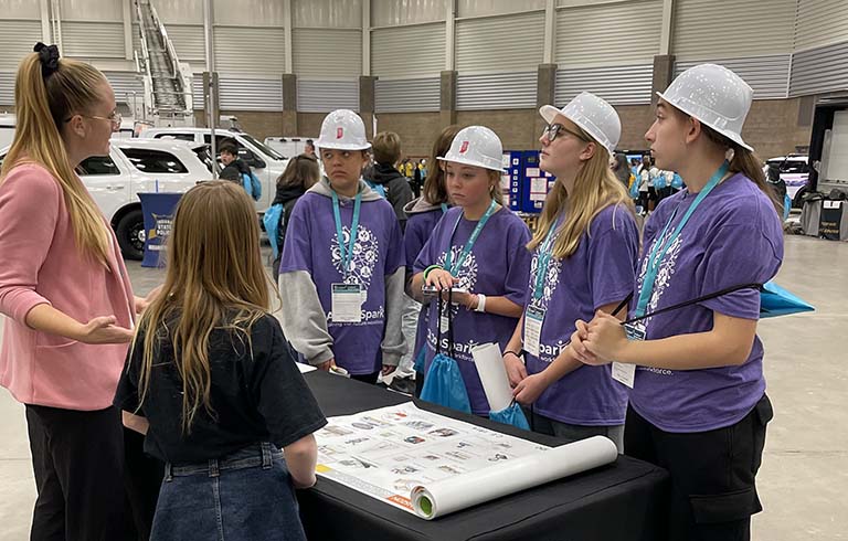 Teacher and students in Memorial Coliseum