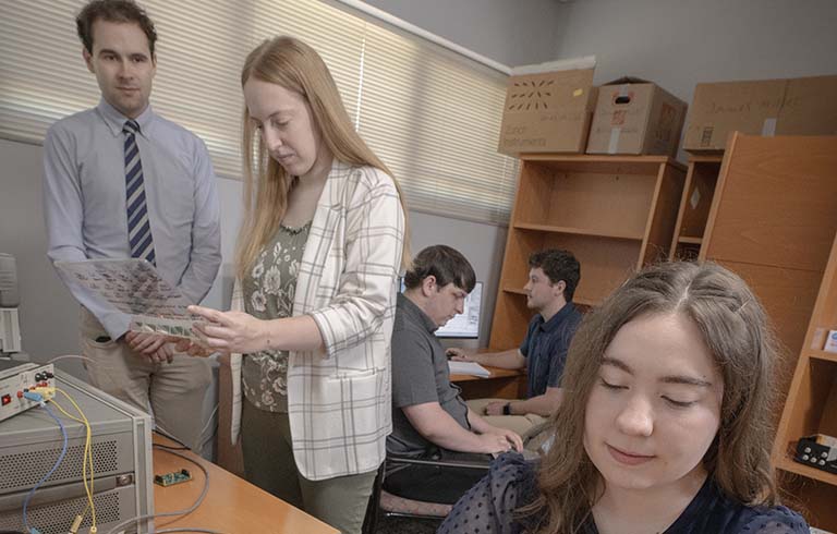 Students and faculty working on MEMS resonator research