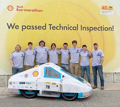 Trine University Shell Eco-marathon team with vehicle