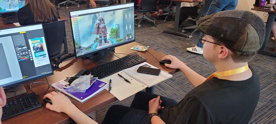 Student with video game character on screen