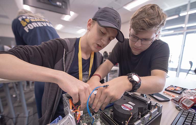 Students assembling a computer