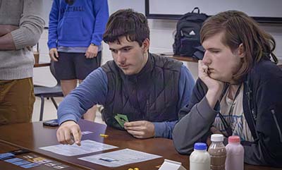 Students playing a board game