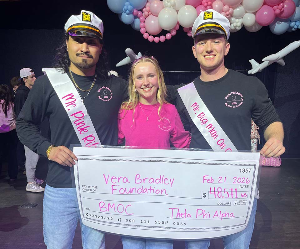 Big Man on Campus winners with chairperson and large check