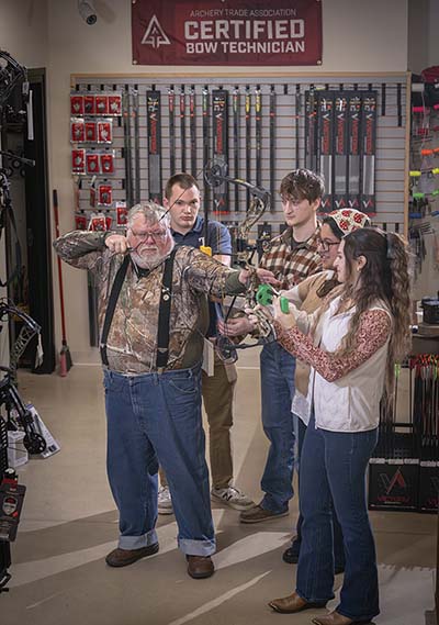 Chester Evitt with Trine students