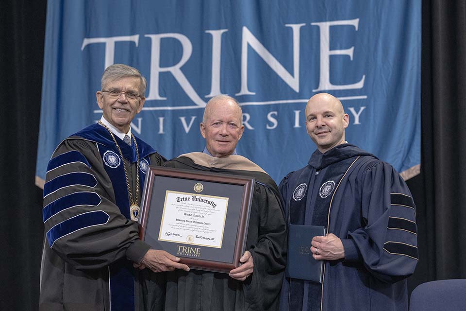 Dr. Brooks, Gov. Daniels holding degree, and Dr. Kline