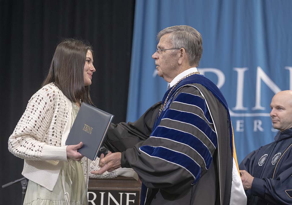 Girl receiving degree from Dr. Brooks