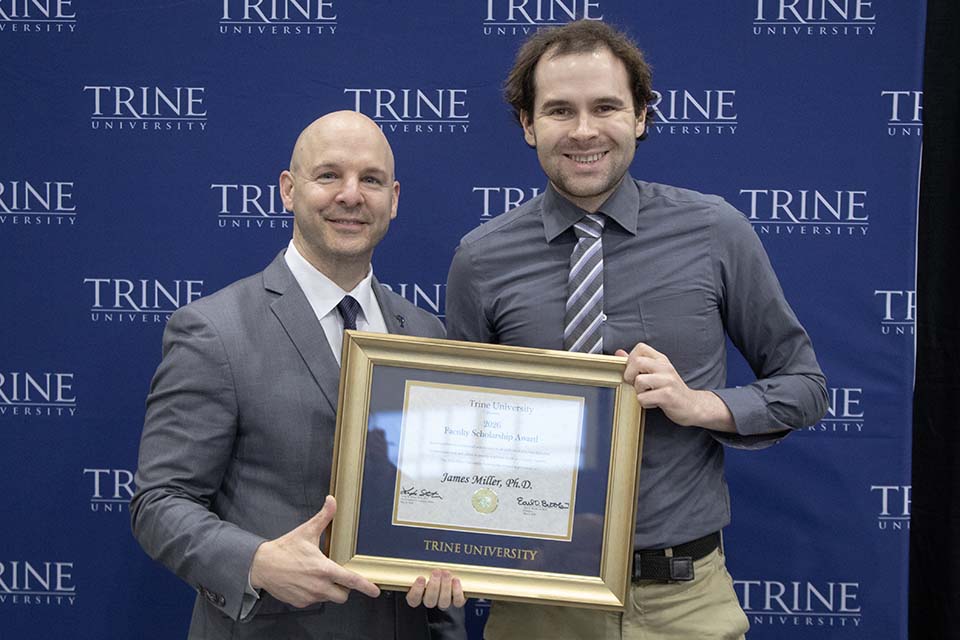 Dr. Kline presents award to Dr. Miller