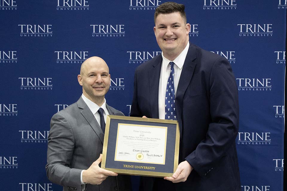 Dr. Kline presents award to Evan Gustin