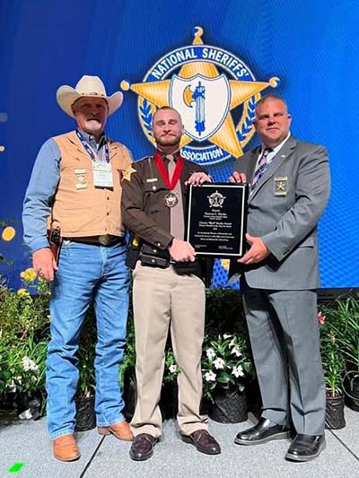 Karson Meeks receiving award