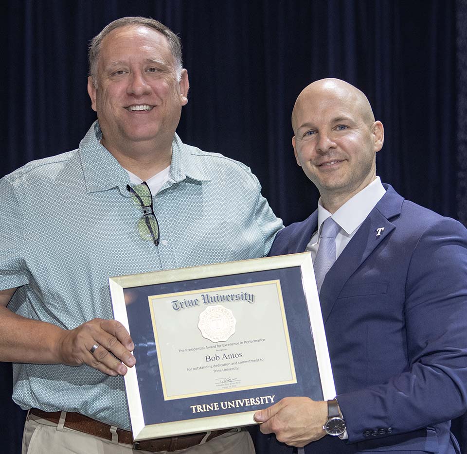 Bob Antos receiving framed certificate from Dr. Tony Kline