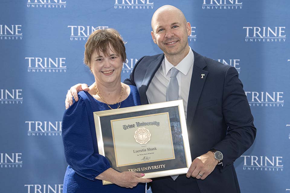 Lucretia Shank with framed certificate standing next to Dr. Tony Kline