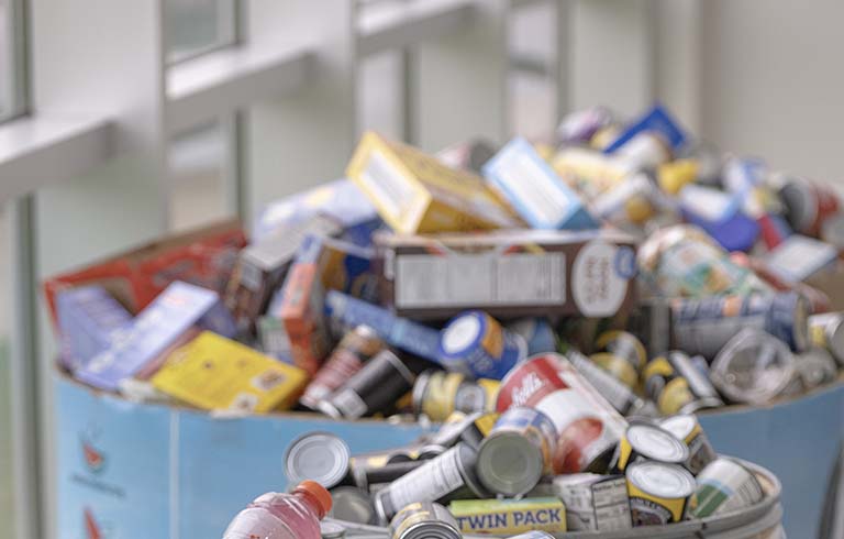 Bins overflowing with canned and boxed food